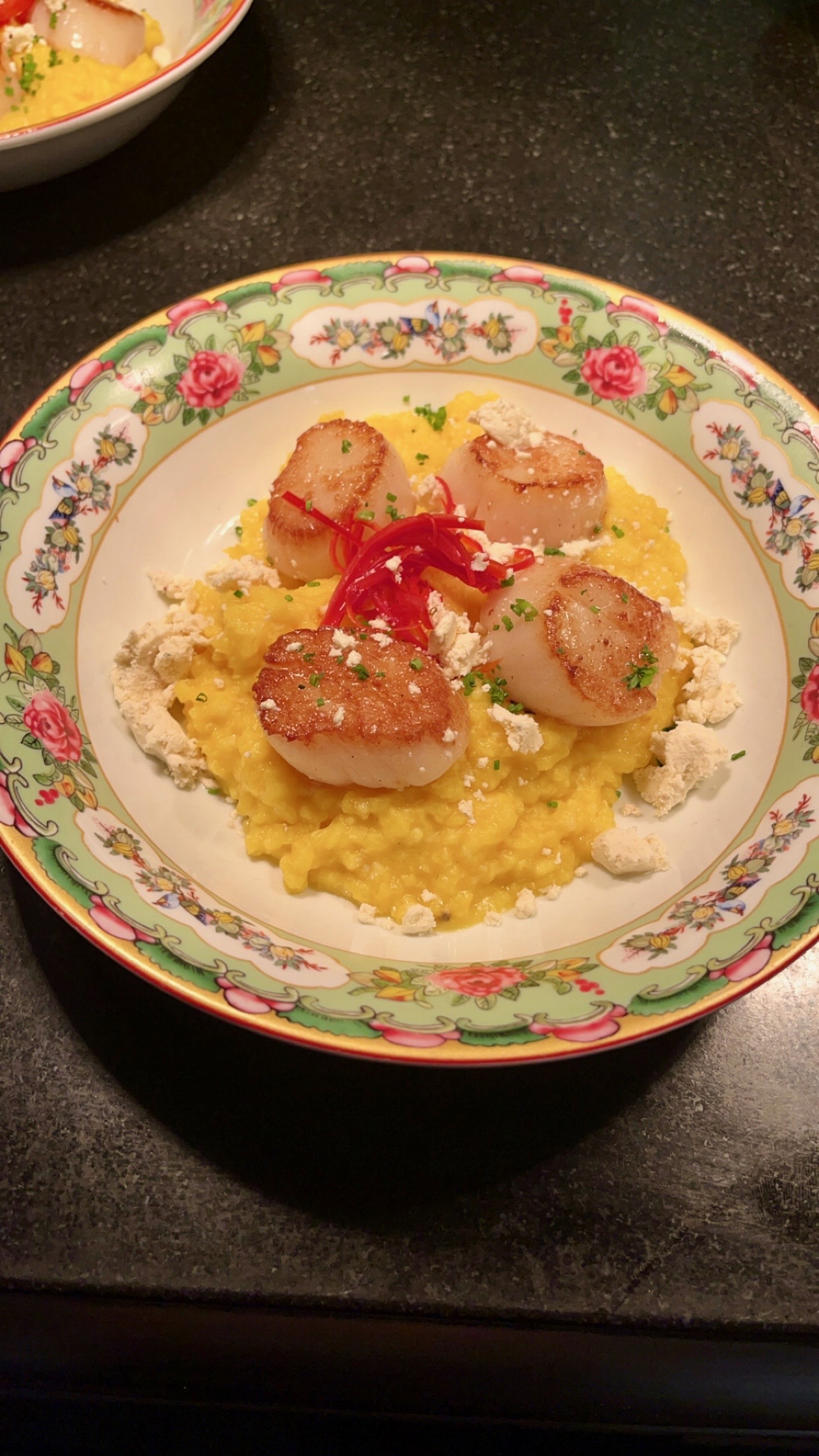 Bay scallops over saffron risotto with brown butter crumble and pickled Fresno peppers